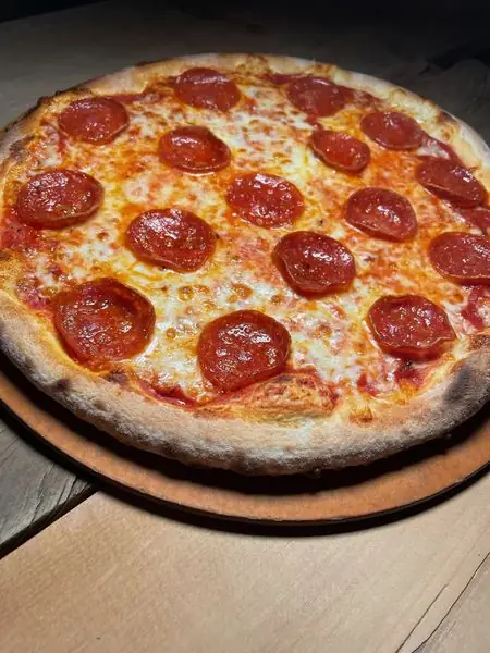Pepperoni pizza with a blistered wood-fired crust
