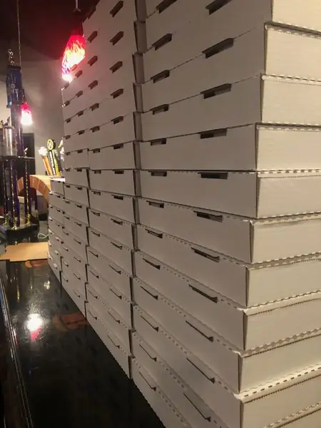 Stacked Broken Tree Pizza takeout boxes ready for carry out