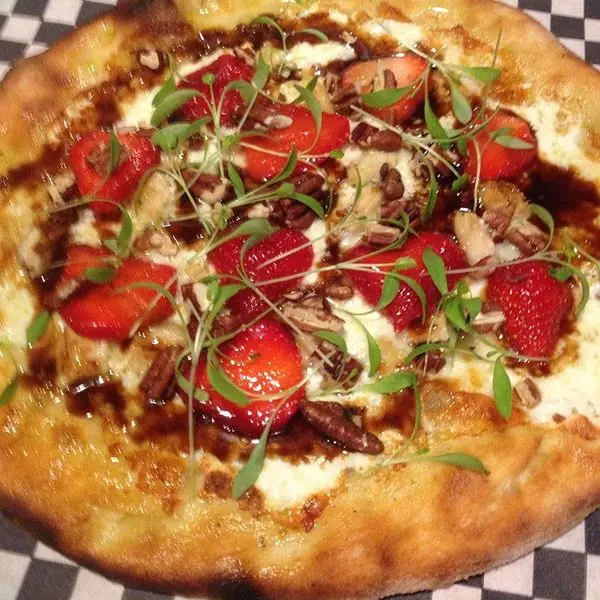 A strawberry, pecan and balsamic pizza